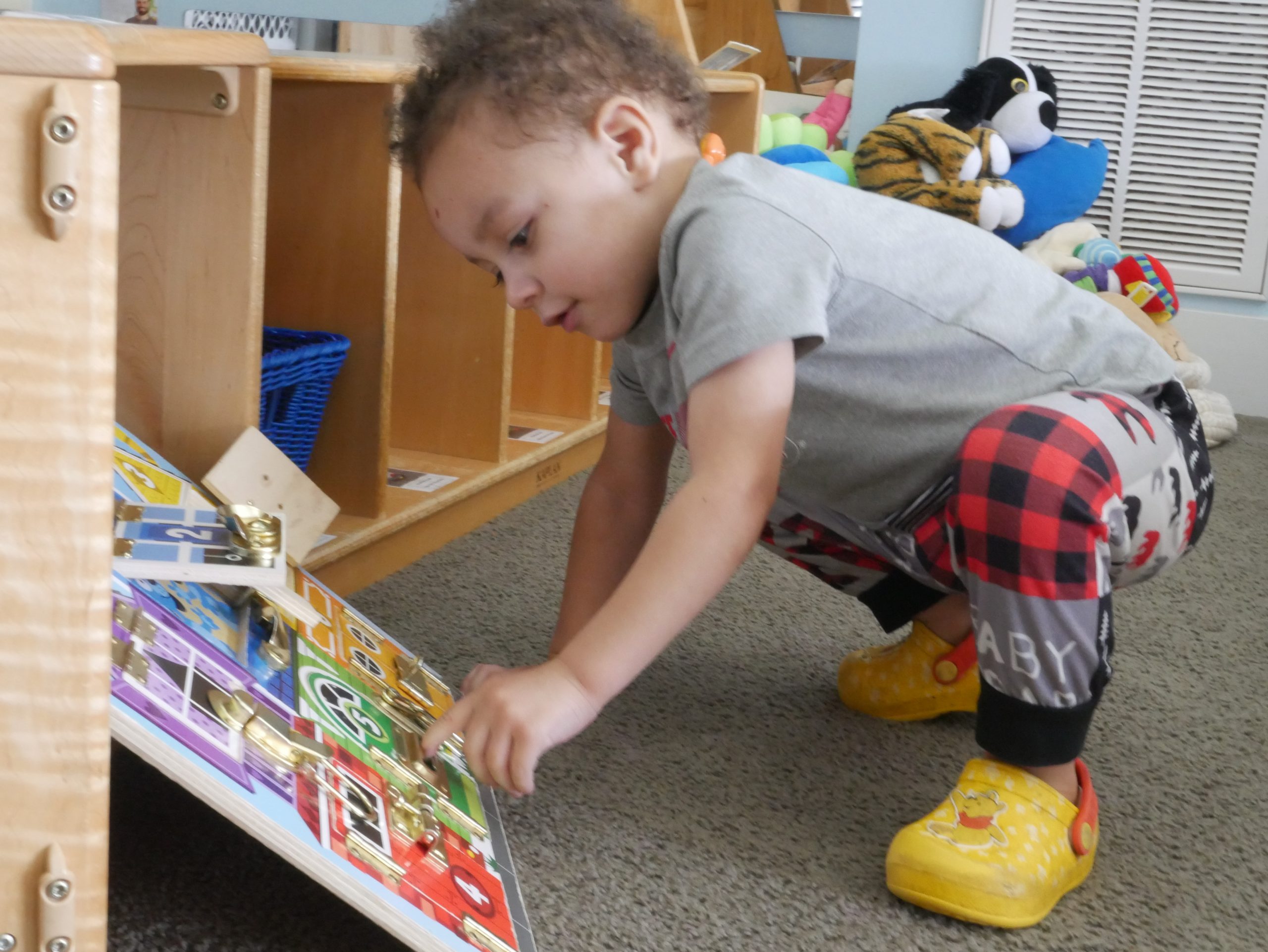 A kid playing with game board