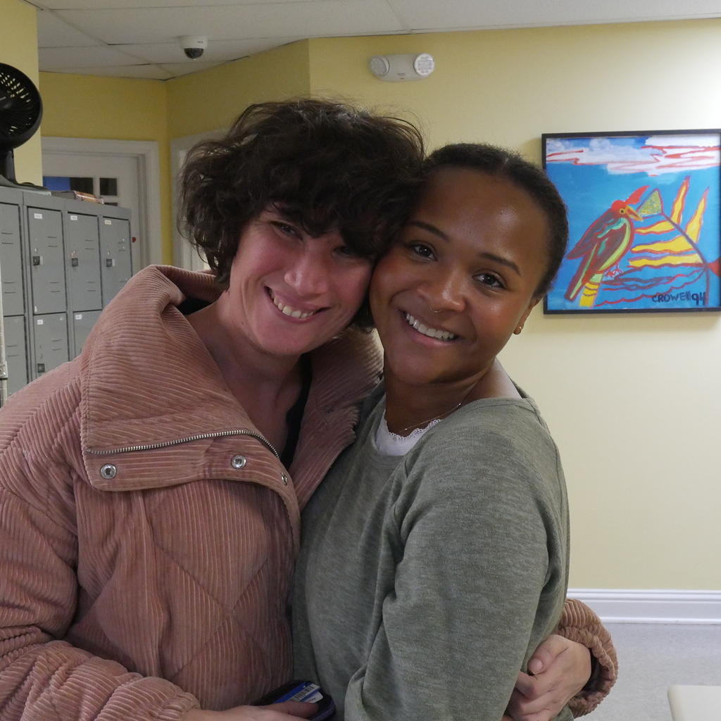 Two person hugging each other and smiling 