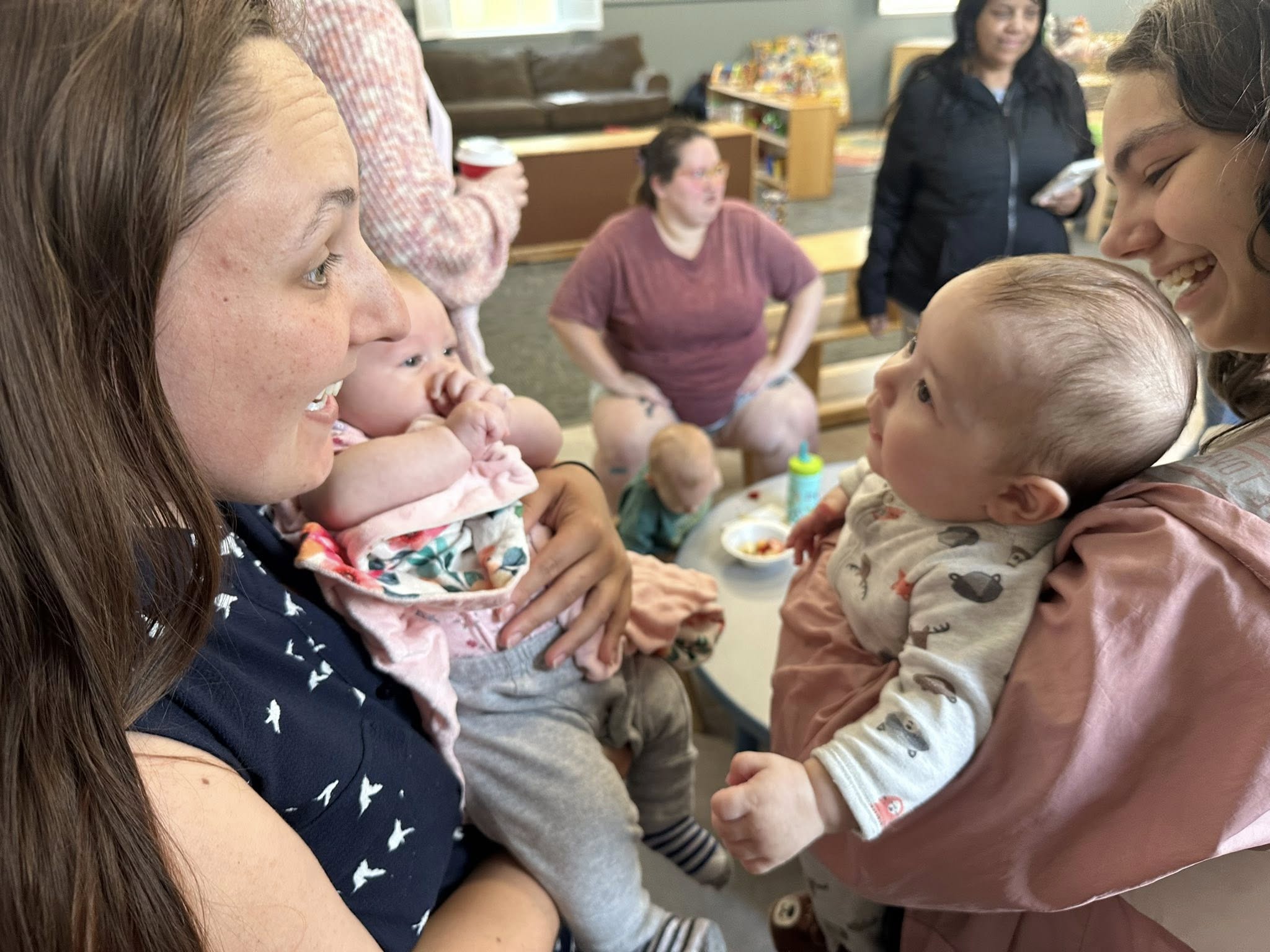 Two women holding babies